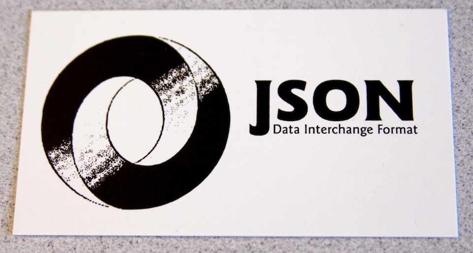 The front side of the JSON business card shows a logo (source: Eric Miraglia).